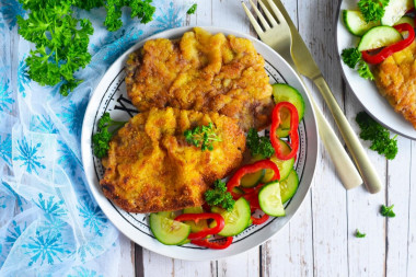 Beef schnitzel in a frying pan