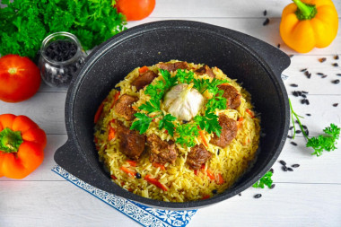 Uzbek beef pilaf in a cauldron