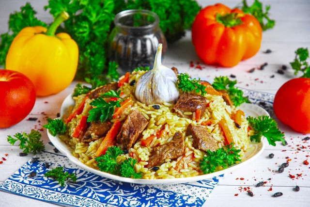 Uzbek beef pilaf in a cauldron