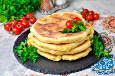 Khachapuri on kefir with cottage cheese in a frying pan