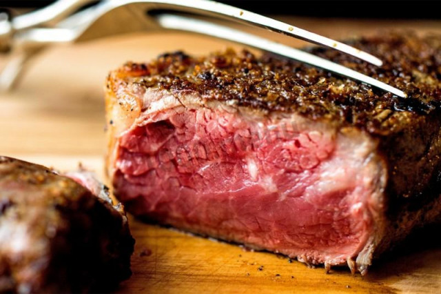 Veal steak in a frying pan