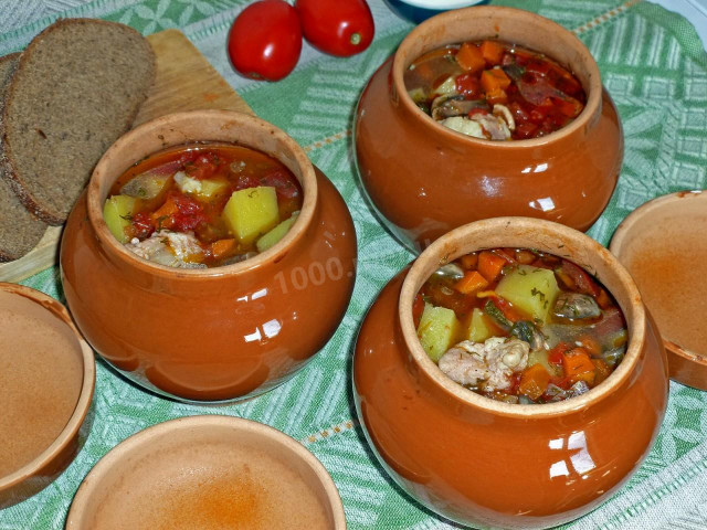 Soup in pots in the oven