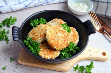 Pollock cutlets in a frying pan