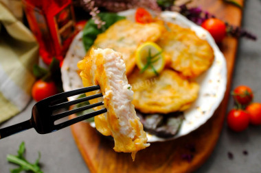 Pangasius in batter in a frying pan