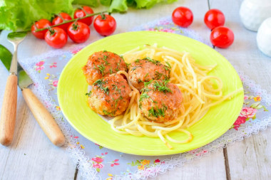 Meatballs with tomato paste gravy in a frying pan