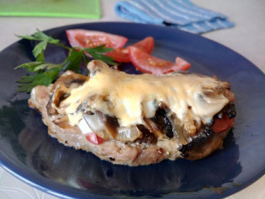 Pork with mushrooms in the oven