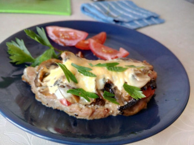 Pork with mushrooms in the oven