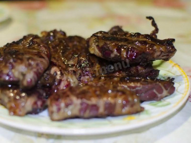 Liver in a fat grid barbecue on the grill