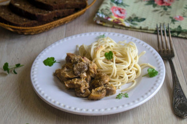 Meat with mushrooms in a slow cooker