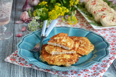 Pork chops with cheese in a frying pan in batter