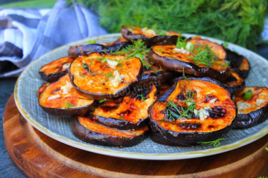 Eggplant on a grill on coals