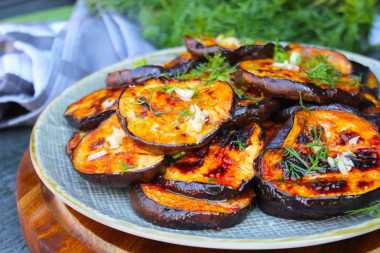 Eggplant on a grill on coals