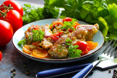 Delicious pork ribs in a frying pan stewed with vegetables