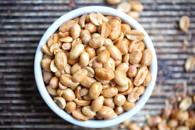 Peanuts with salt in a frying pan