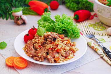 Bulgur with turkey and vegetables in a frying pan