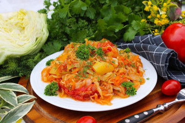 Stewed potatoes with cabbage in a saucepan