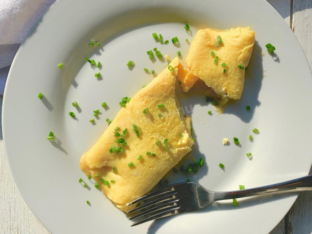 Omelet roll in a frying pan