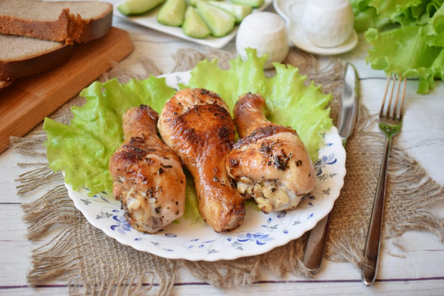 Chicken drumstick in a frying pan with a crispy crust