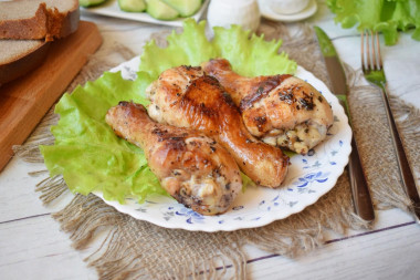 Chicken drumstick in a frying pan with a crispy crust