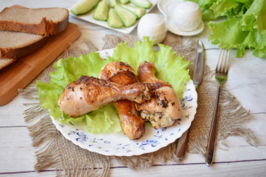 Chicken drumstick in a frying pan with a crispy crust