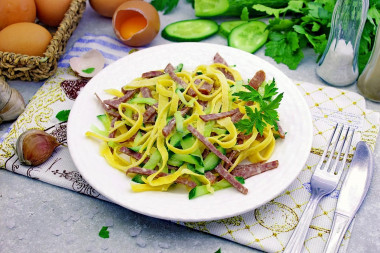 Salad with pancakes and smoked sausage