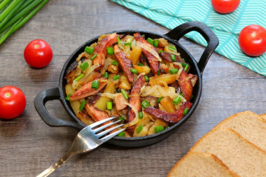 Potatoes with sausage in a frying pan