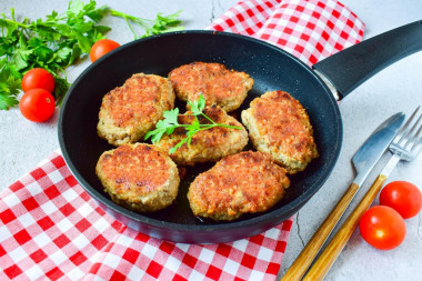 Minced meat patties in a frying pan