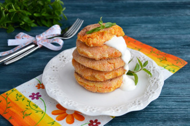 Cheesecakes with carrots and cottage cheese in a frying pan