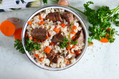 Beef pilaf in a frying pan