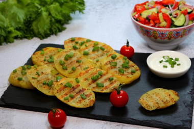 Grilled potatoes in a frying pan