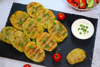 Grilled potatoes in a frying pan