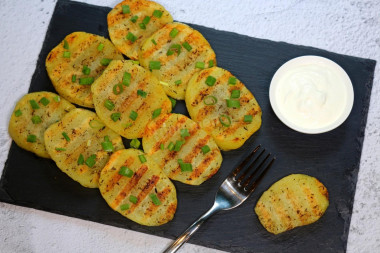 Grilled potatoes in a frying pan