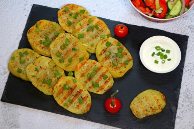 Grilled potatoes in a frying pan