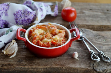 Pork belly with cheese and tomatoes in the oven