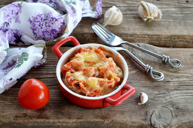 Pork belly with cheese and tomatoes in the oven