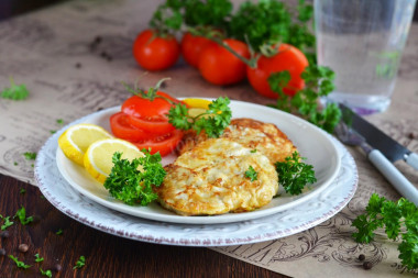 Pork in egg and flour in a frying pan