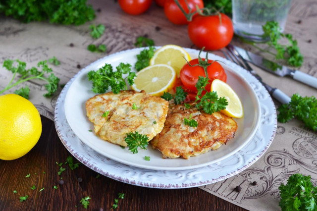 Pork in egg and flour in a frying pan