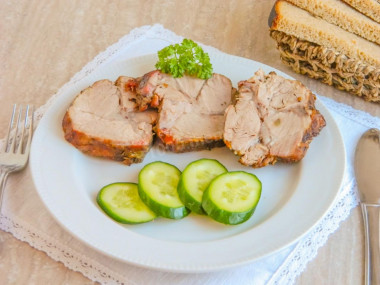 Pork neck baked in the oven in a whole piece