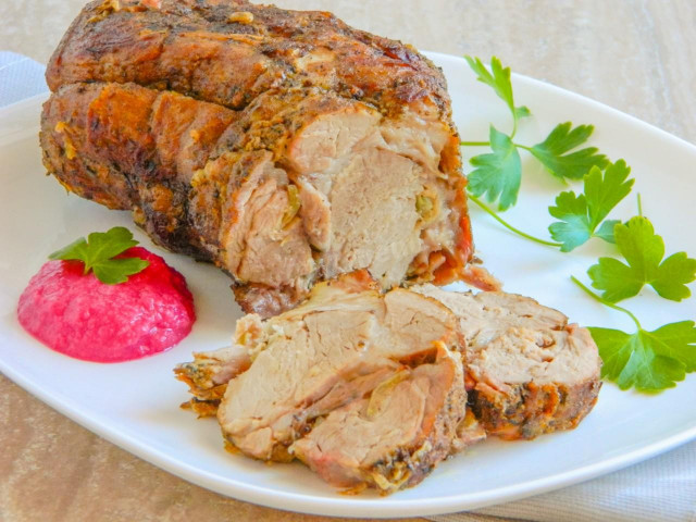 Pork neck baked in the oven in a whole piece