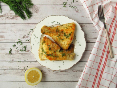 Flounder in flour in a frying pan