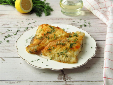 Flounder in flour in a frying pan