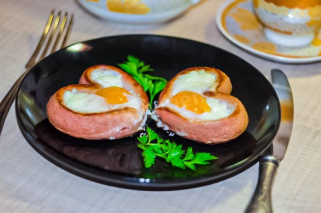 Fried eggs with a heart and sausage