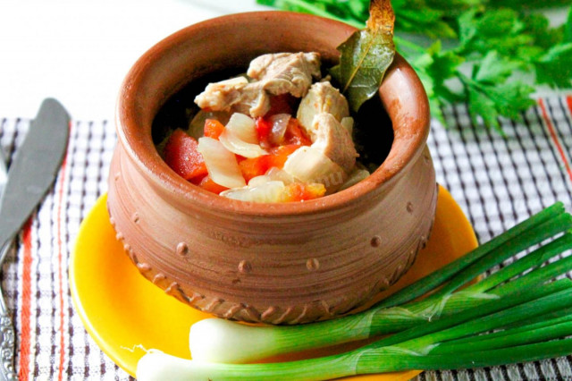 Stewed meat in pots in the oven