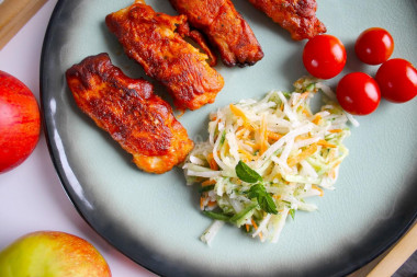 Pangasius fillet in tomato batter in a frying pan