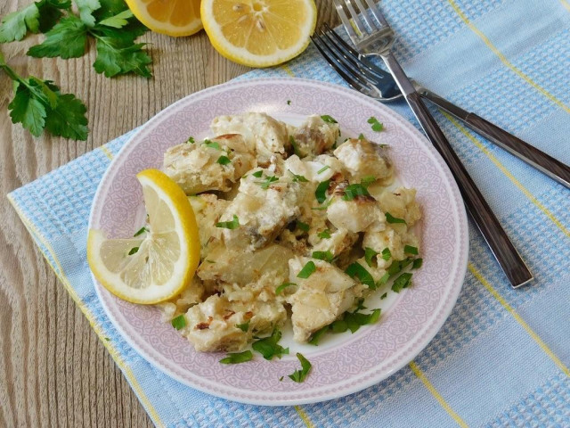 Fish stewed in sour cream with onions