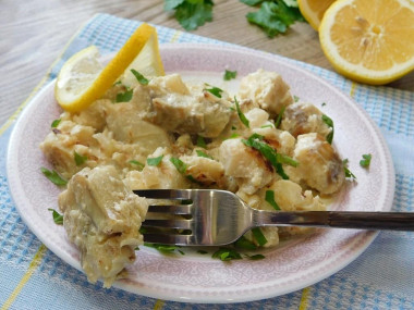 Fish stewed in sour cream with onions