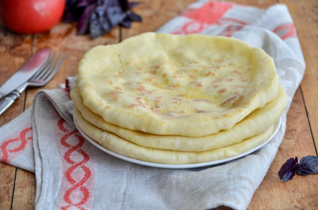 Khachapuri stuffed with pickled cheese without greens