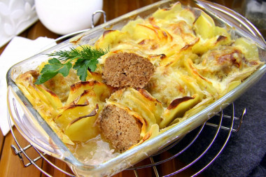 Meat patty casserole with potato slices and cheese