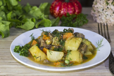 Beef stew with tomatoes, potatoes, zucchini and curry