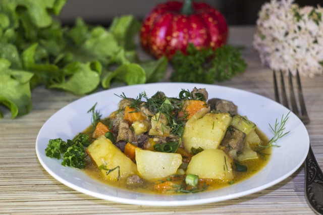 Beef stew with tomatoes, potatoes, zucchini and curry